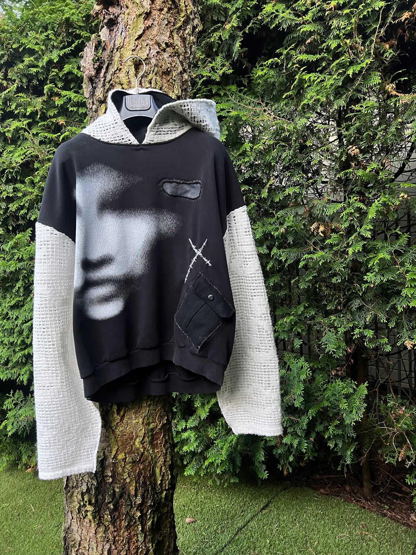face print, cross pocket hoodie